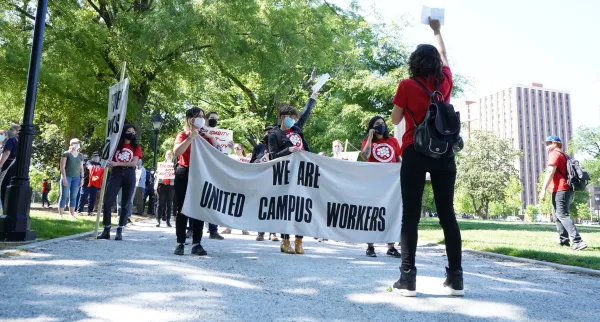 VCU workers rally in Monroe Park.