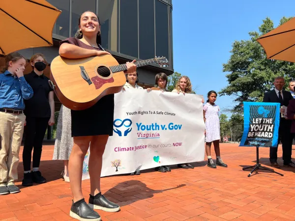 Climate justice plaintiffs hold a press conference and rally outside of John Marshall Courthouse.
